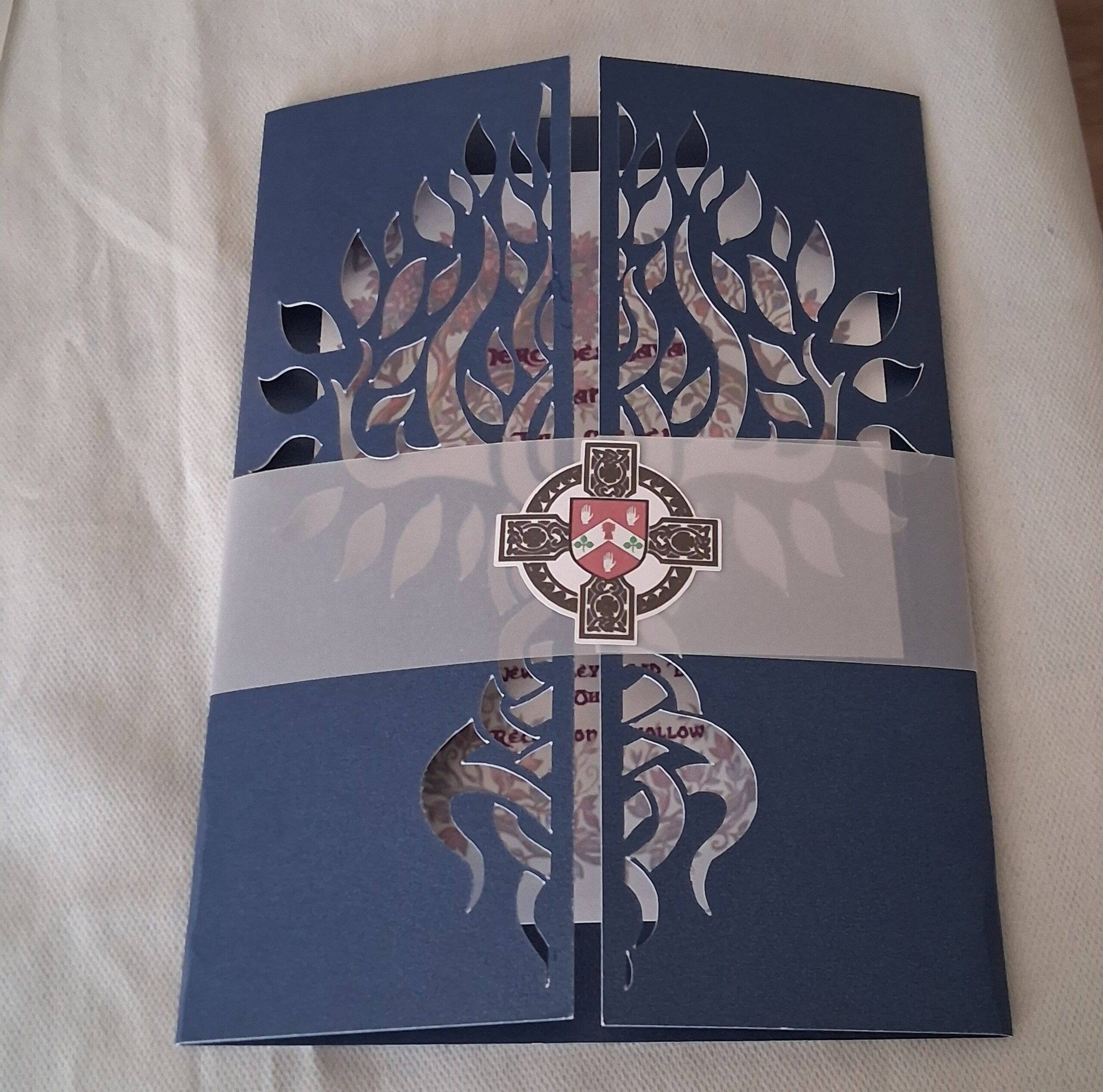 Celtic wedding gatefold invitation closed with belly band